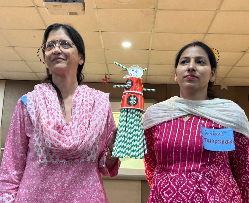Teachers with student project